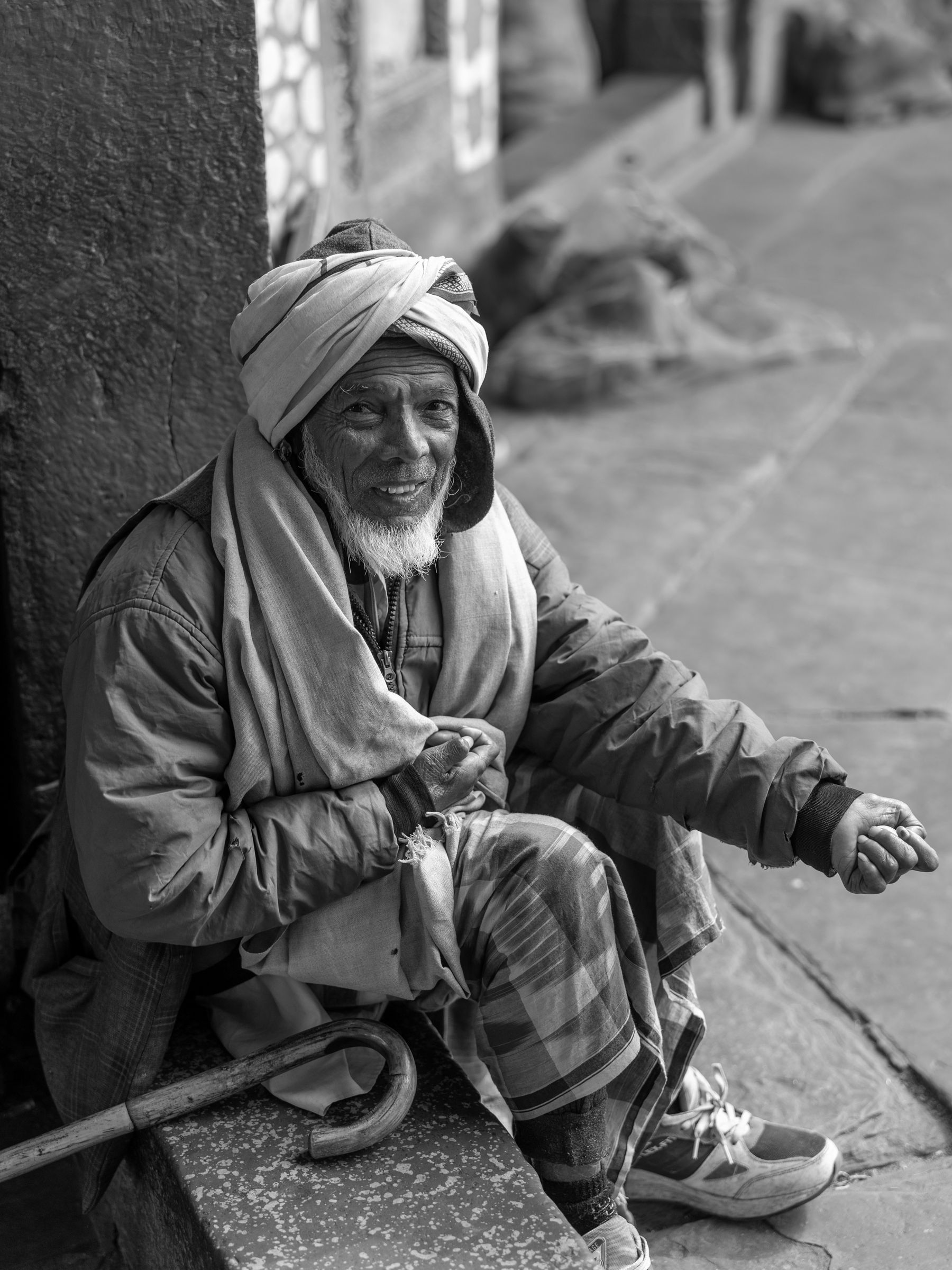 Elderly Seated Man Portrait In Black And White